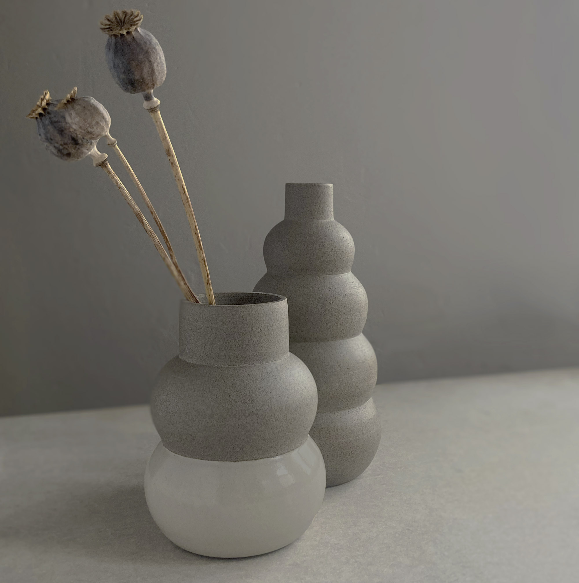 2 grey stoneware bubble vases with cream glaze